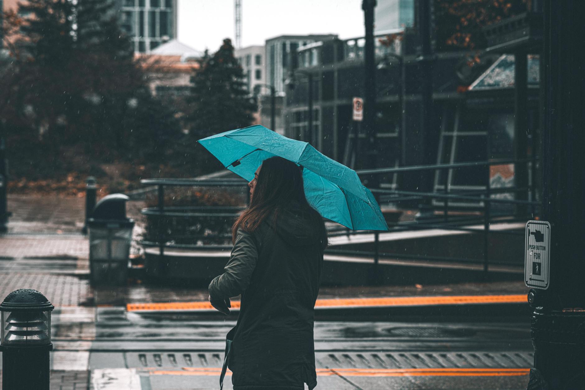 Rainy Vancouver street with umbrella