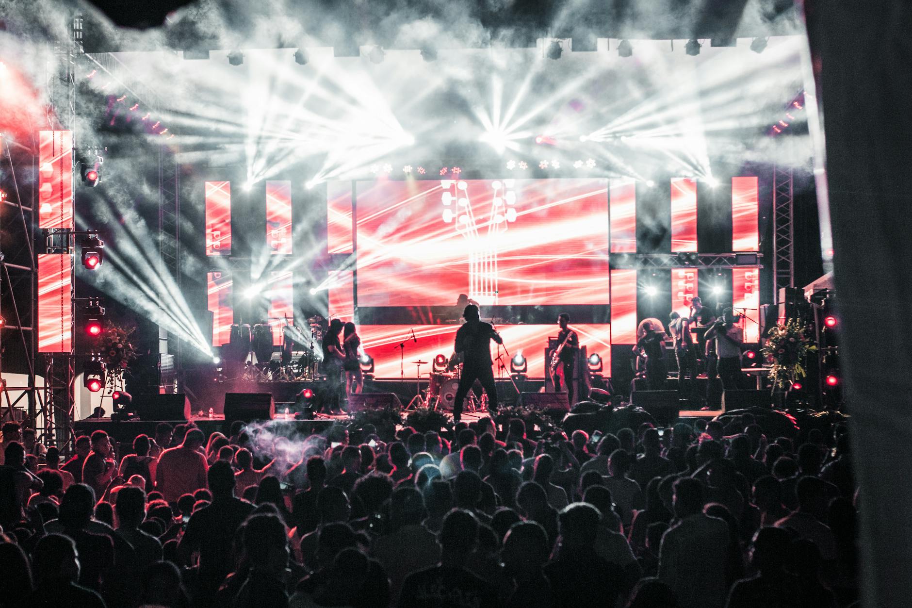 Large summer music festival crowd stage