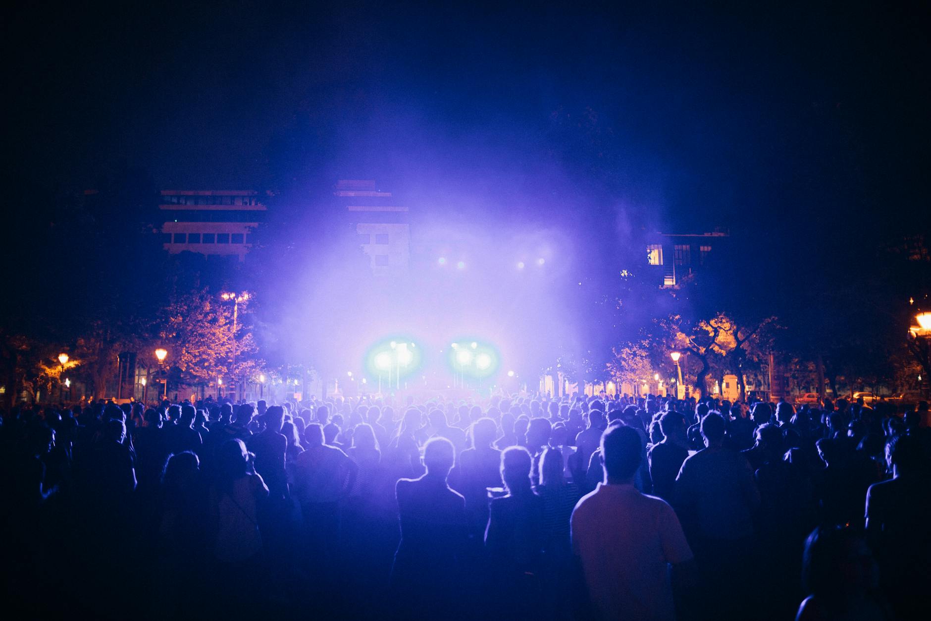 Night festival crowd lights and stage