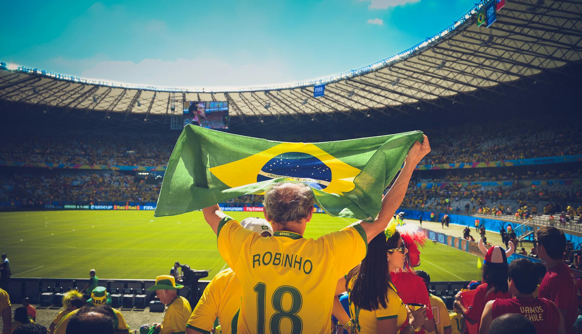 World Cup fans celebrating with flags and crowds in a city square