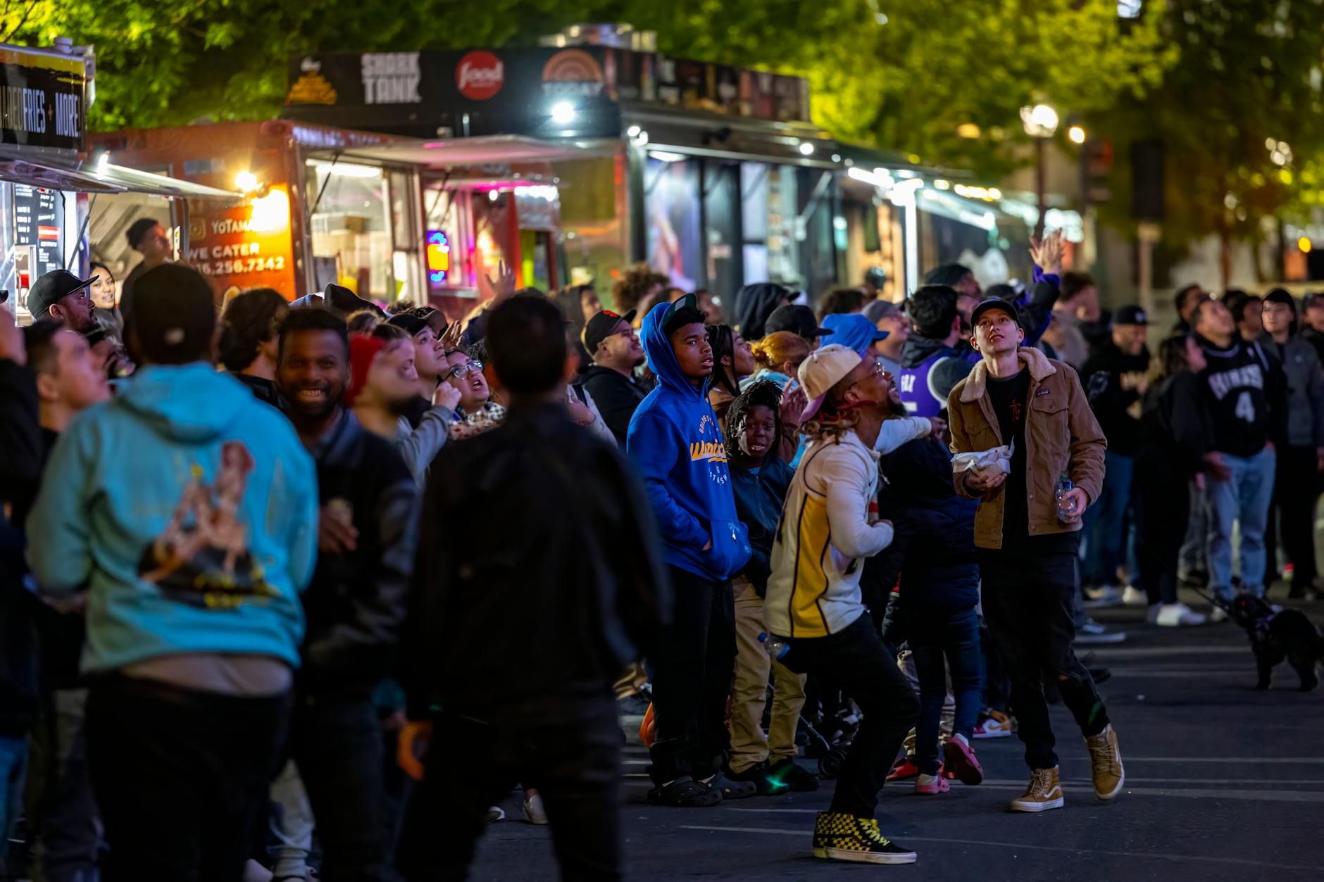 Food truck with lunch queue on city street