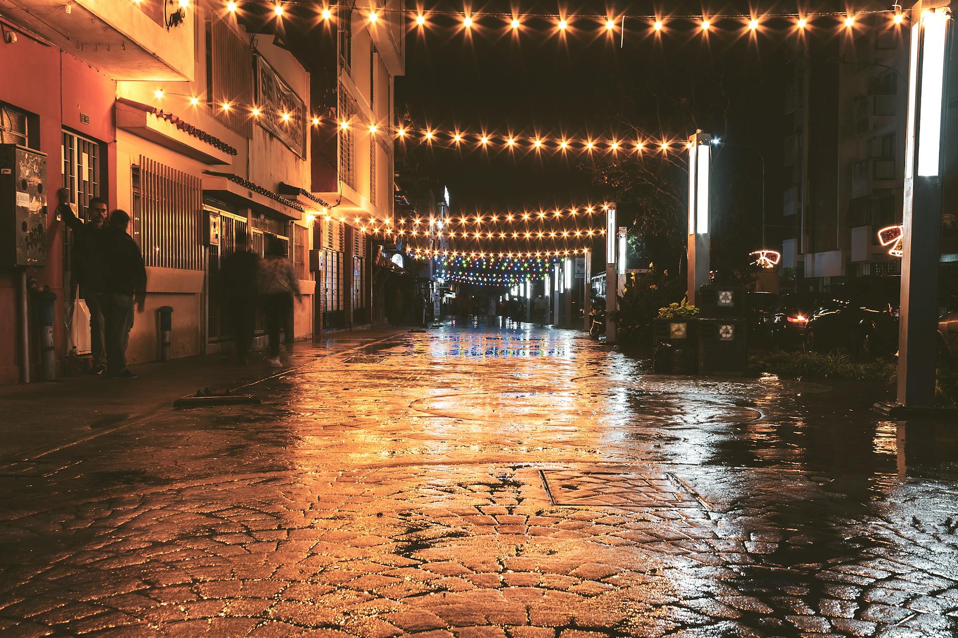Historic cobblestone street at night
