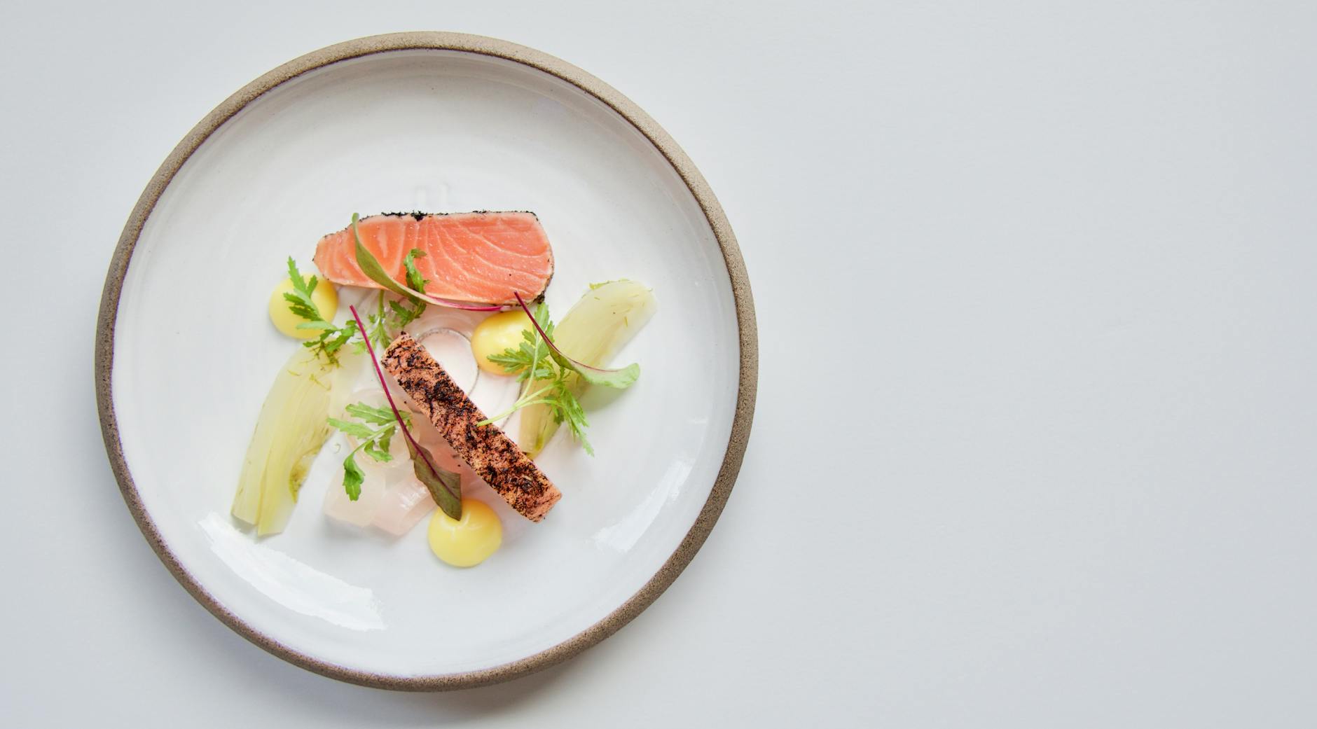 Wild Pacific salmon plated with seasonal sides