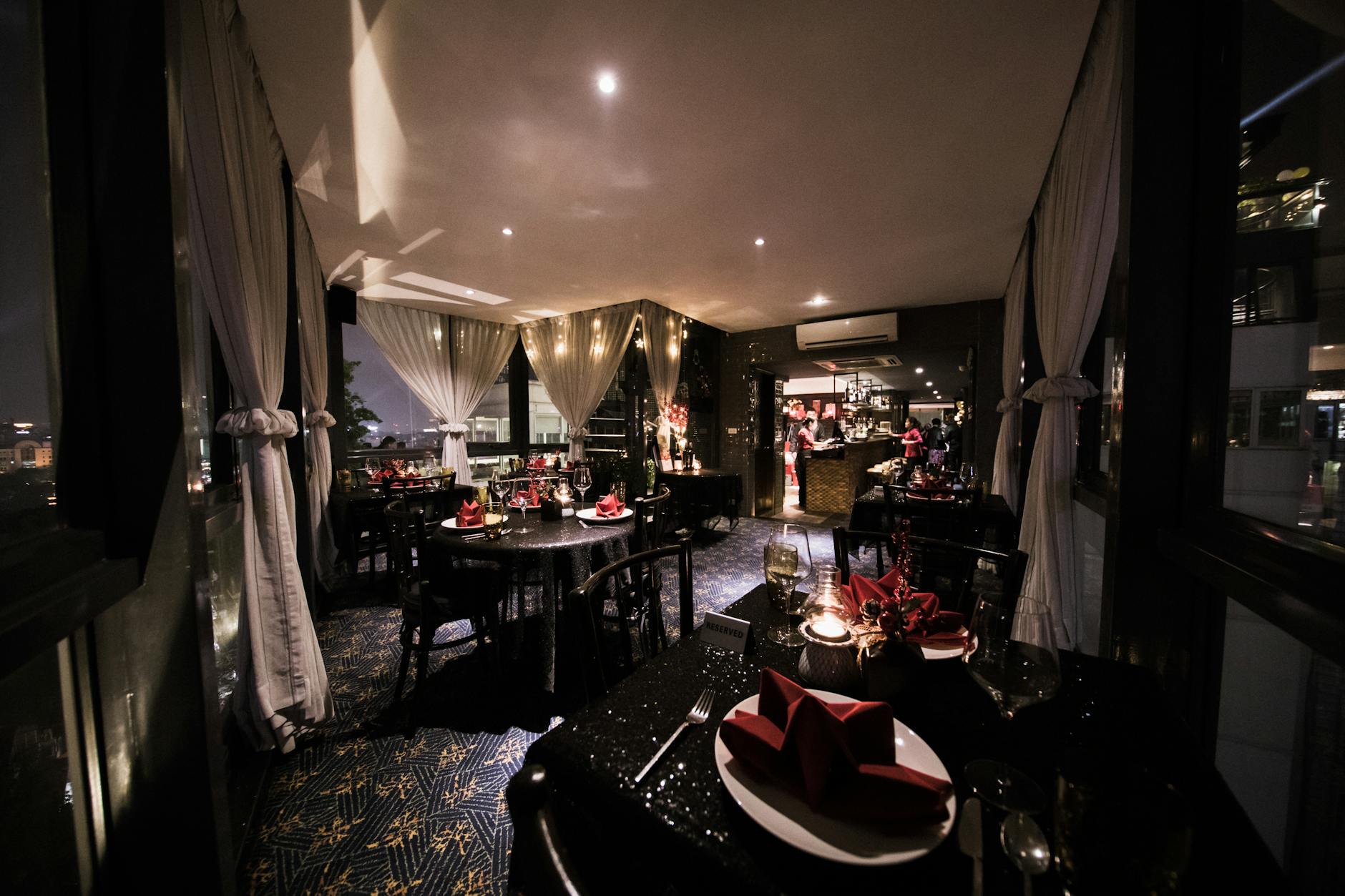 Fine dining restaurant table with city night view