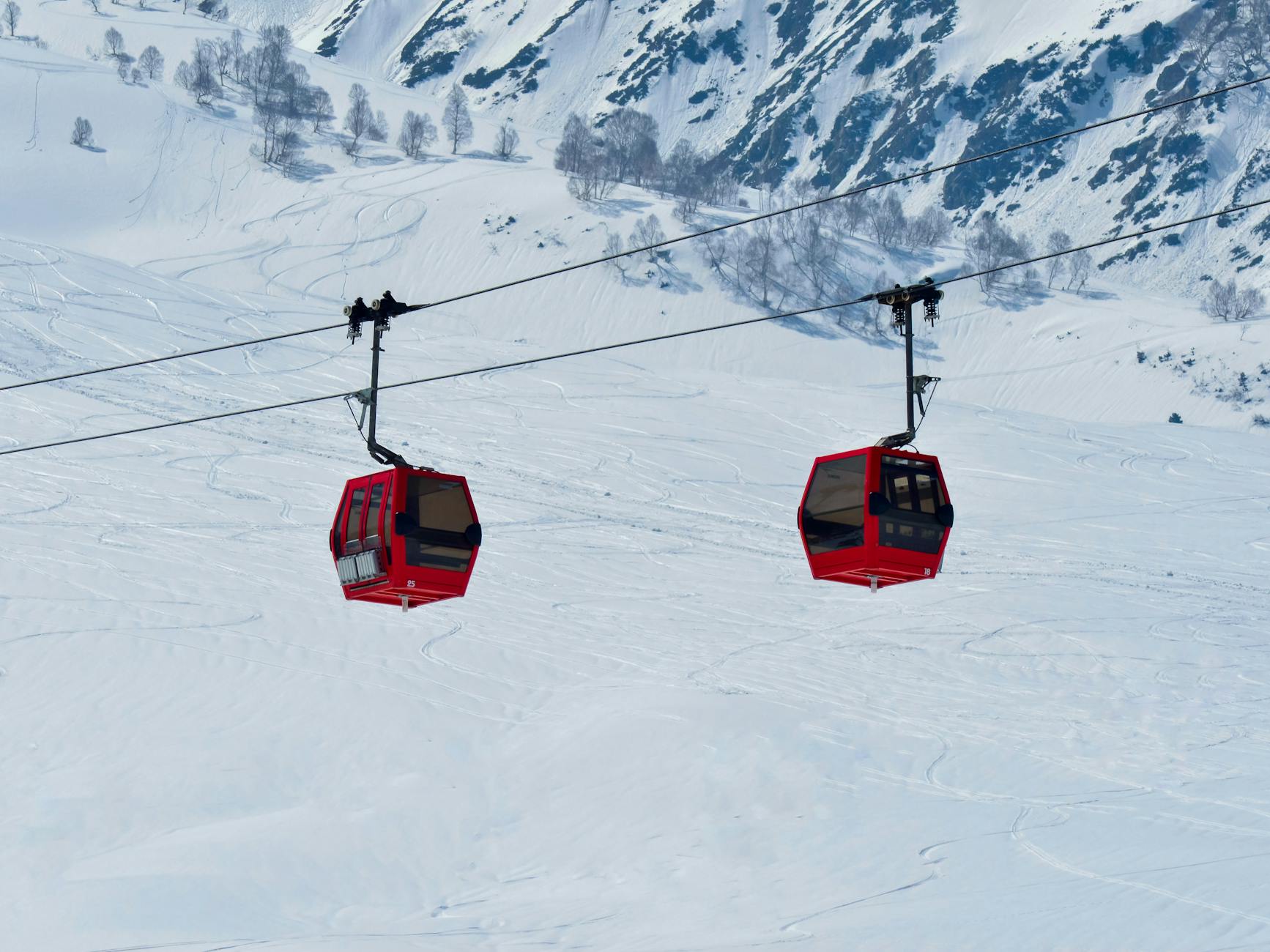 Mountain gondola lift with snow