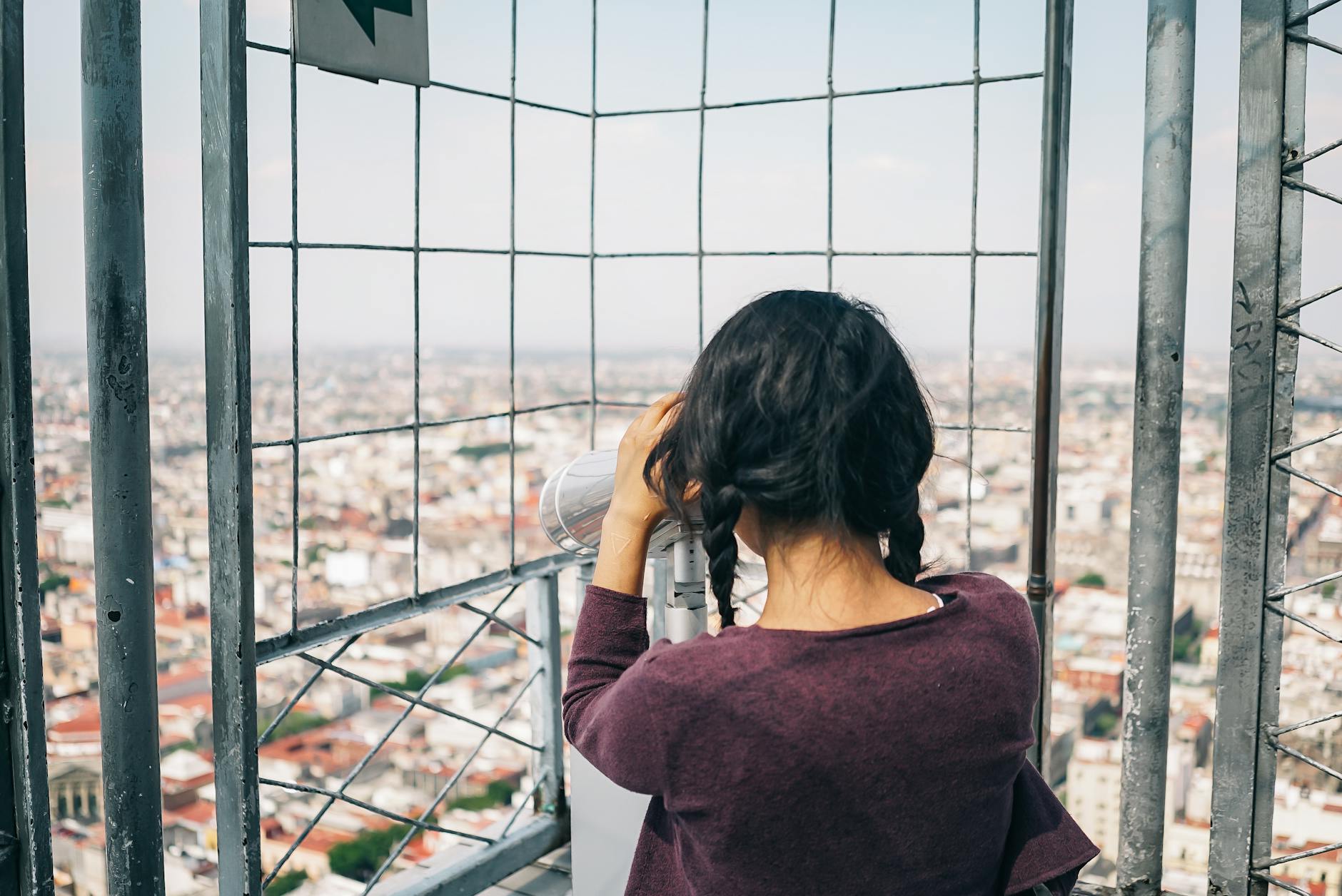 Tourists on observation deck looking at city