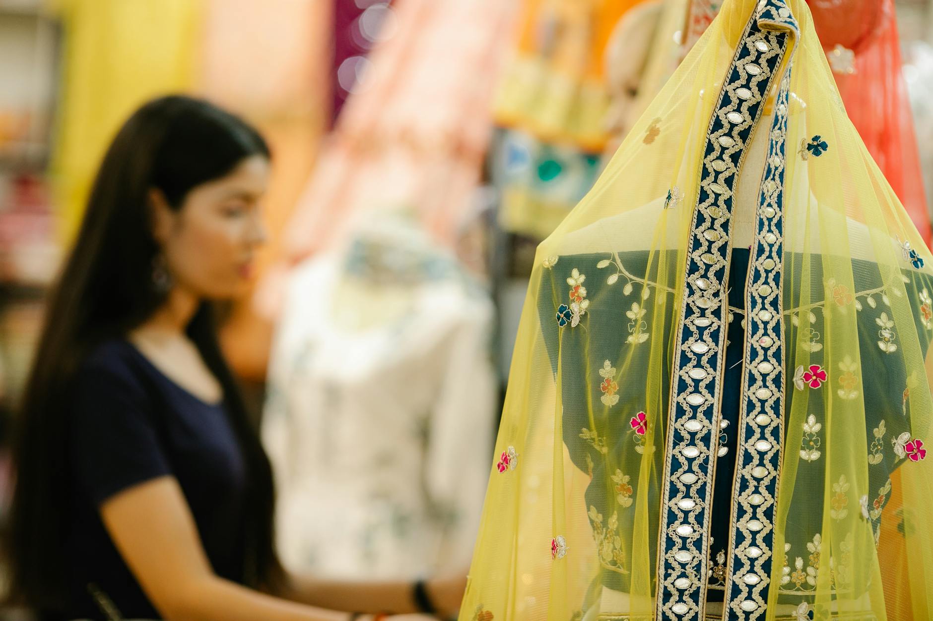 Colorful sari fabric display in South Asian shop