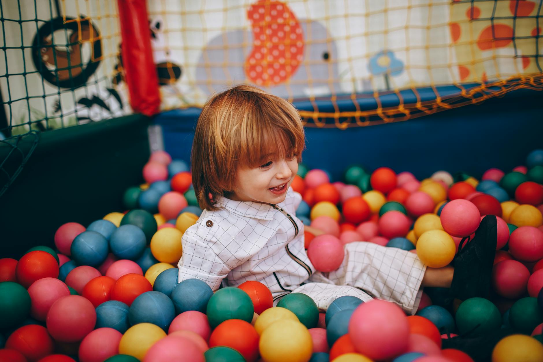 Children playing in indoor activity area