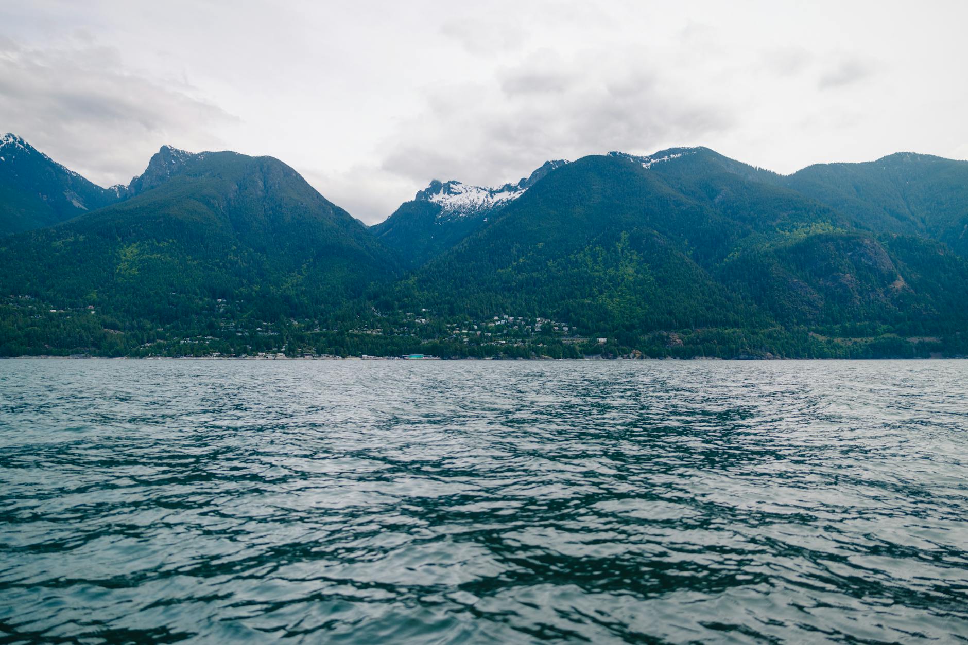 Sea to Sky Highway winding along Howe Sound coast with islands in the distance