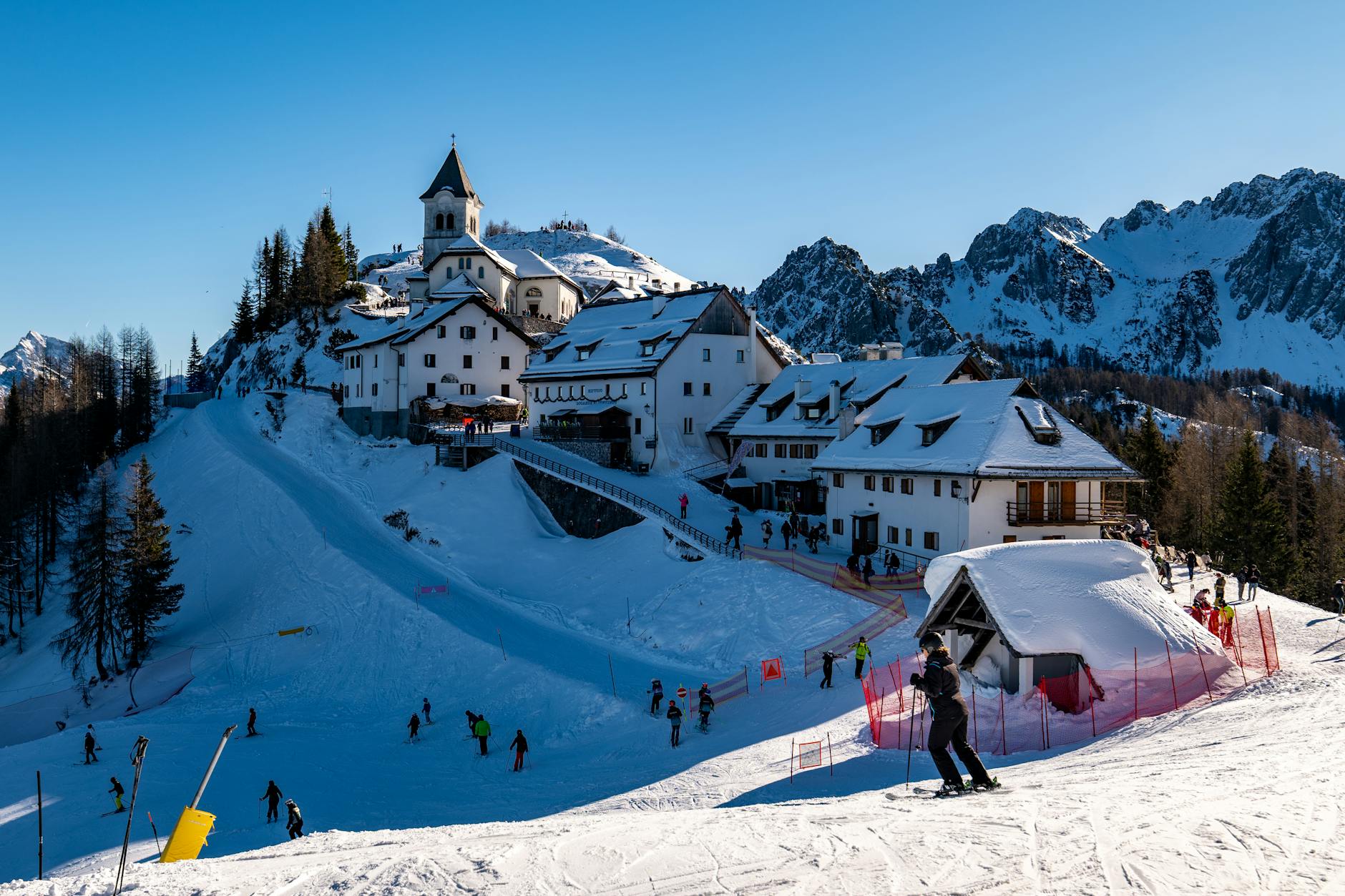Alpine ski village with mountains and snow