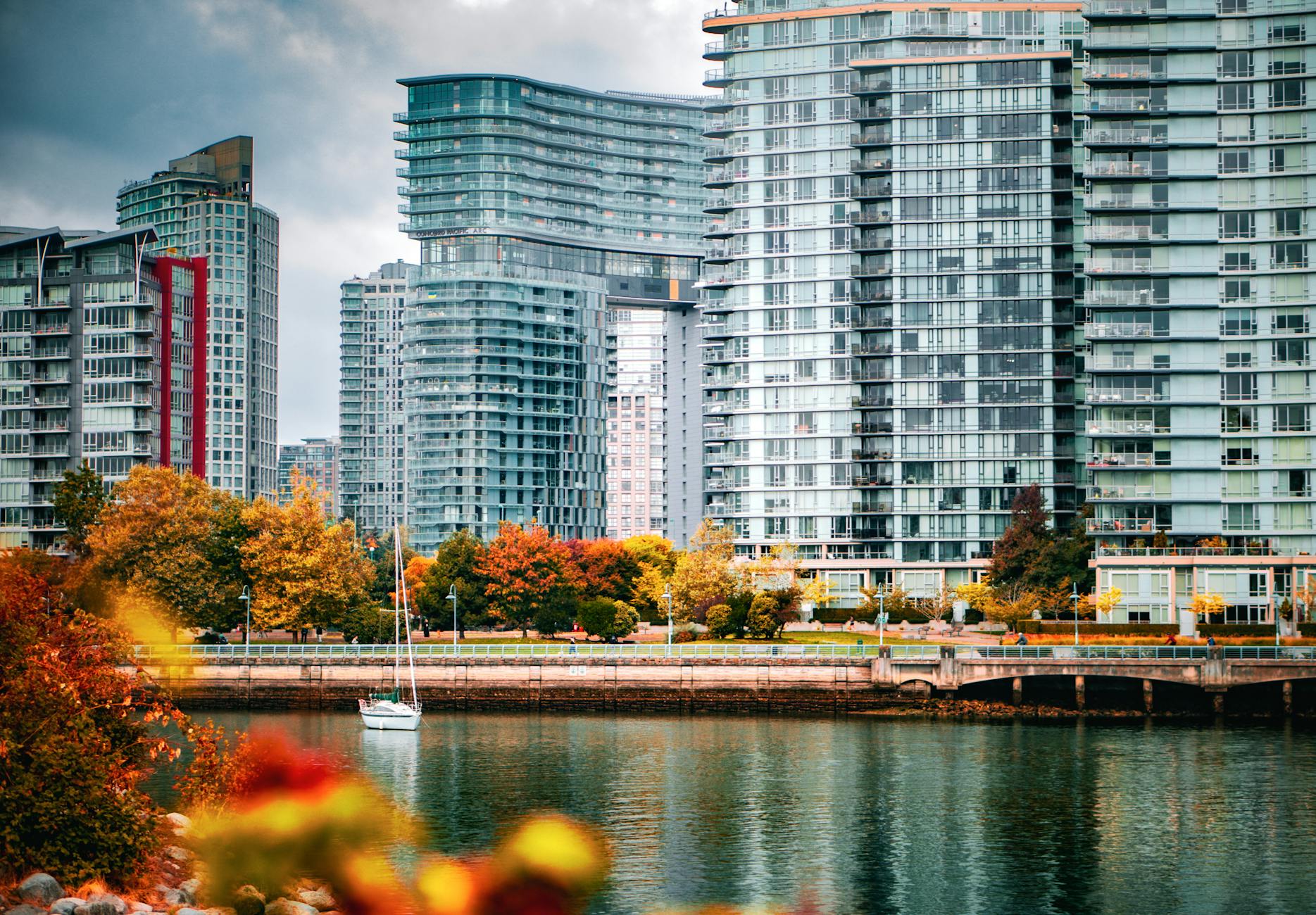 Urban neighbourhood with mid-rise residential towers and tree-lined pedestrian street
