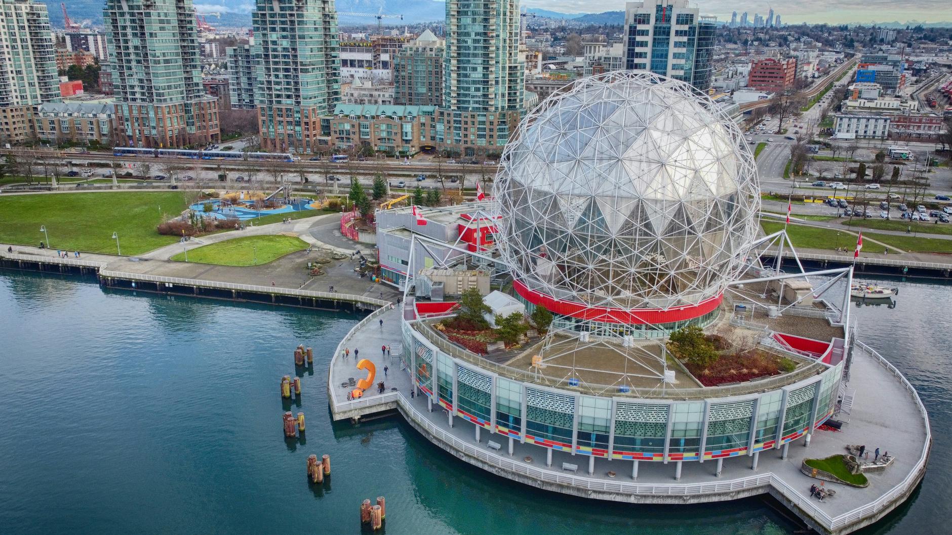 Stunning aerial shot of Science World and False Creek in Vancouver, Canada showcasing urban architecture and waterfront.