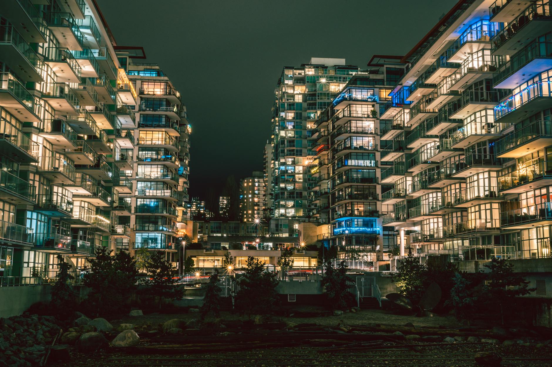 Captivating night view of illuminated high-rise buildings in North Vancouver's urban setting.