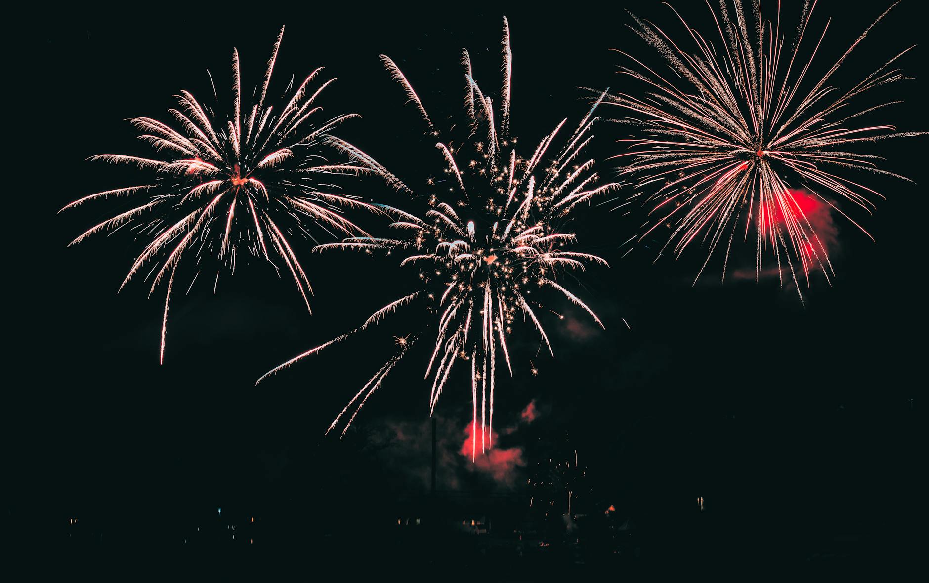 Vibrant fireworks illuminating the night sky with colorful bursts.