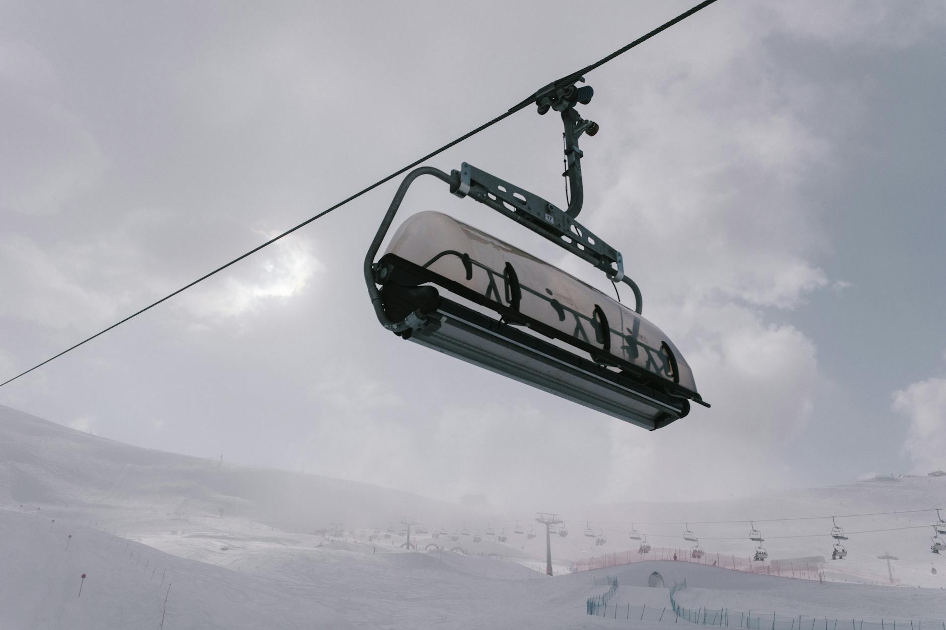 Floodlit ski runs at night above the lights of Vancouver.