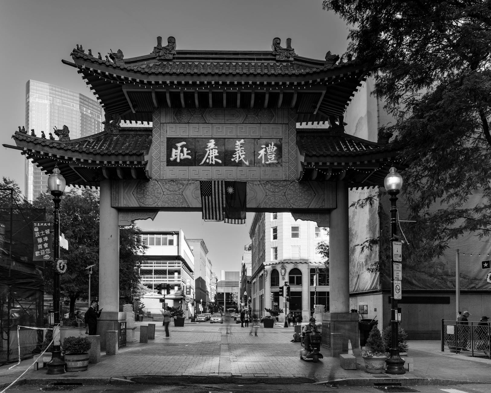 The ornate tiled roof and red columns of the Chinatown Millennium Gate on Pender Street, Vancouver.
