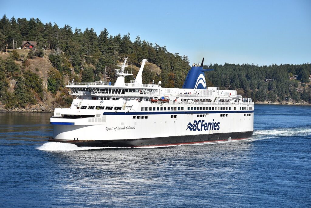 BC Ferries vessel Spirit of British Columbia sailing past forested islands
