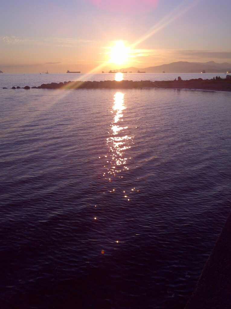Sun setting over English Bay, one of the free romantic things to do in Vancouver