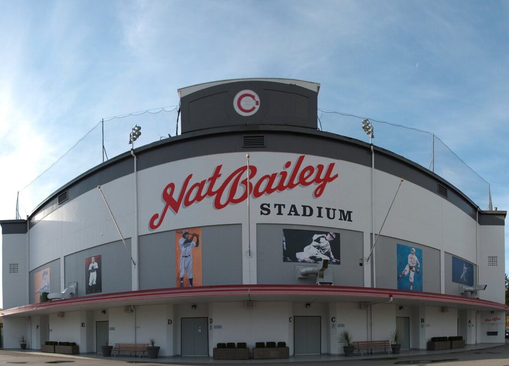 Front facade of Nat Bailey Stadium with its script sign and old-fashioned grandstand
