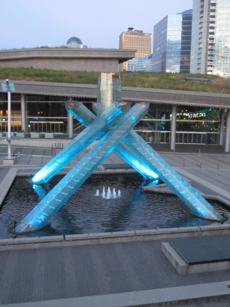 The 2010 Olympic Cauldron lit blue beside the Vancouver Convention Centre, the best known of the Vancouver Olympic sites