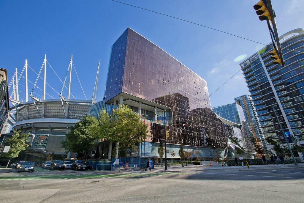 The Parq Vancouver casino and hotel tower beside the white roof masts of BC Place