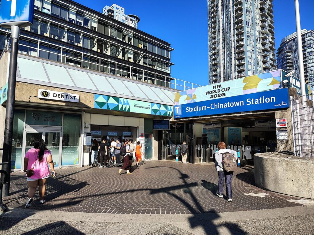 Beatty Street entrance of Stadium–Chinatown SkyTrain station with passengers walking in